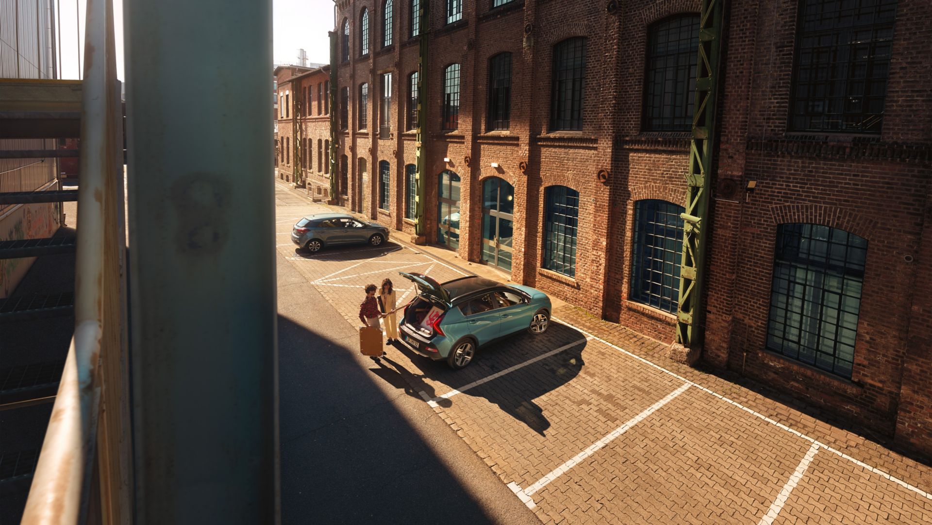 The all-new Hyundai BAYON compact crossover SUV parked in a lot with an open boot space.