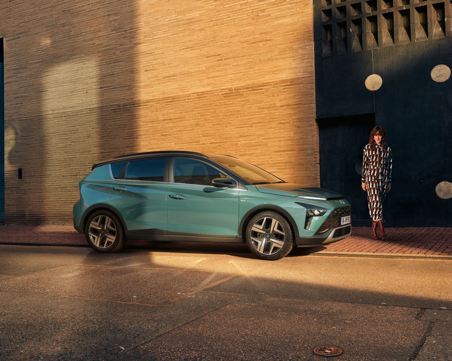 The all-new Hyundai BAYON compact crossover SUV parked in the colour Mangrove Green Pearl.